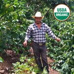 Honduras coffee producer S. Vasquez on his farm. USDA green coffee beans Honduras